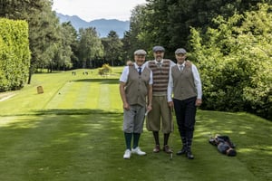 Three golfers in traditional hickory golf clothing posing together on the tee box at Circolo Golf Villa d’Este.