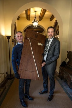 Presentation of the handcrafted Hickory Masters champion trophy featuring a vintage hickory golf club during the prizegiving ceremony.