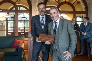 Senior category runner-up receiving The Hickory Masters handcrafted wooden trophy during the prizegiving ceremony.