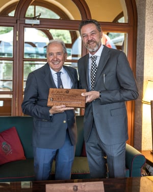 Open category third-place winner holding The Hickory Masters handcrafted wooden trophy.