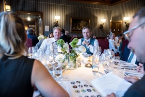 Guests enjoying dinner during The Hickory Masters gala at the golf club clubhouse.