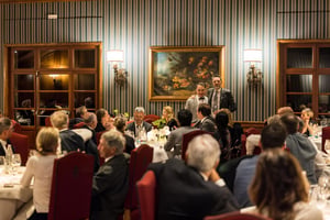Guests gathered during The Hickory Masters gala dinner as an award recipient is introduced to the audience.