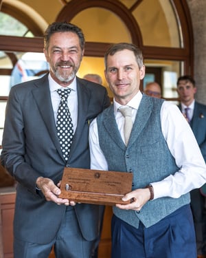 Amateur category champion posing with The Hickory Masters wooden trophy after the awards ceremony.