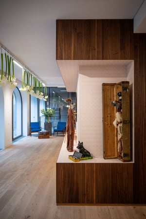 Side view of a display area featuring antique golf bags, vintage equipment, and decorative items inside the Hickory Golf Masters Museum.