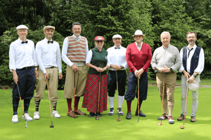 Eight golfers in traditional hickory golf attire standing together on the green at Golf Club Patriziale Ascona during the HGM Tour 2026.